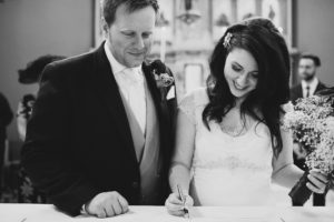 Signing the register at kent wedding