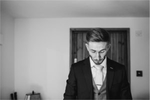 Groom getting ready for wedding at Old Kent Barn