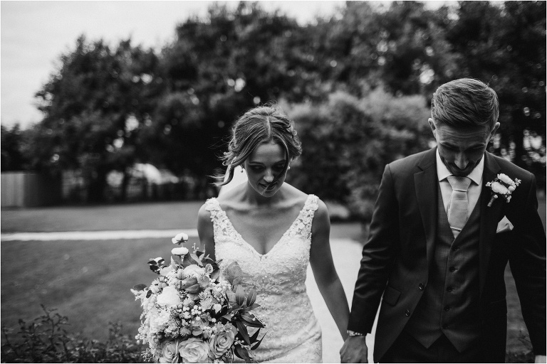 Portraits of bride and groom in the gardens of Old Kent Barn