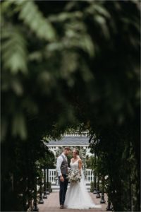 Portraits of bride and groom in the gardens of Old Kent Barn
